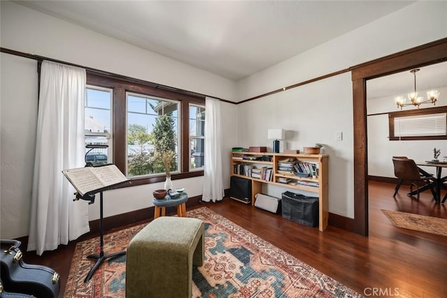 1339 Higuera St, San Luis Obispo, CA 93401 - living area with baseboards, wood finished floors, and an inviting chandelier
