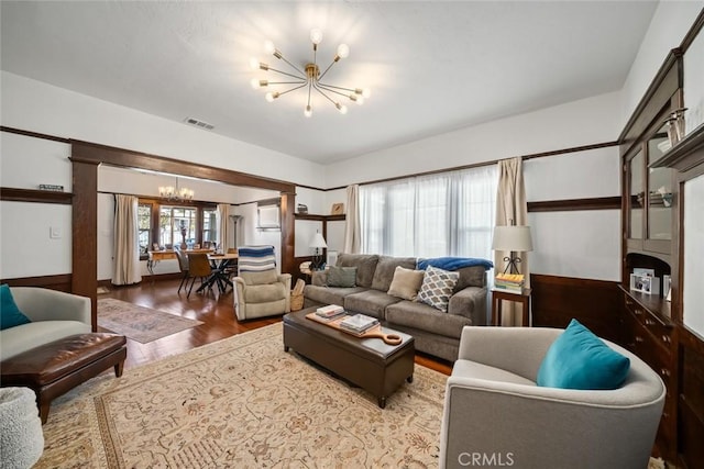 1339 Higuera St, San Luis Obispo, CA 93401 - living area with a notable chandelier, wood finished floors, and visible vents