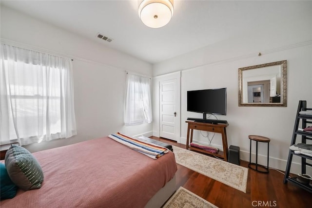 1339 Higuera St, San Luis Obispo, CA 93401 - bedroom with wood finished floors, visible vents, and baseboards