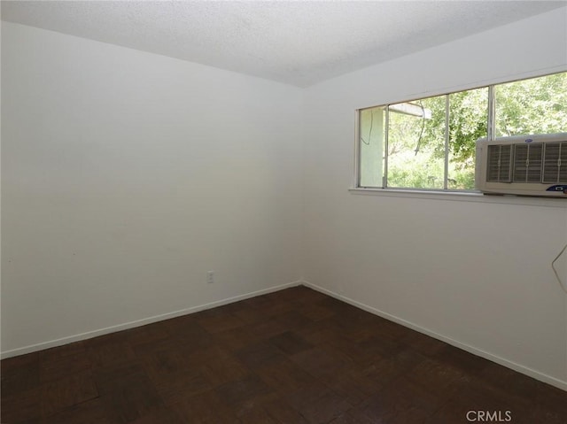 empty room with baseboards