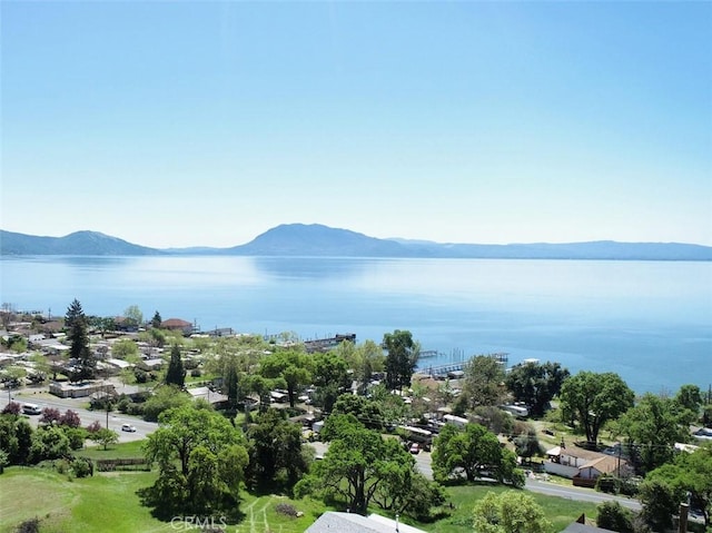 birds eye view of property featuring a water and mountain view