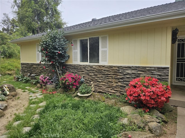 view of property exterior featuring stone siding