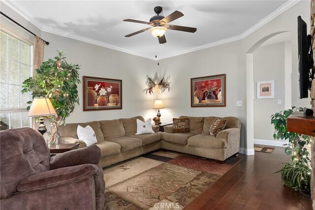 226 Stony Creek Dr, Orland, CA 95963 - living room featuring crown molding, ceiling fan, arched walkways, baseboards, and hardwood / wood-style flooring