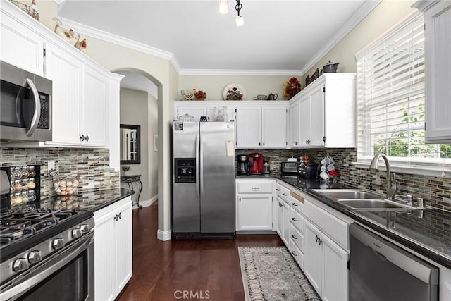 226 Stony Creek Dr, Orland, CA 95963 - kitchen featuring dark countertops, white cabinetry, tasteful backsplash, a sink, and appliances with stainless steel finishes