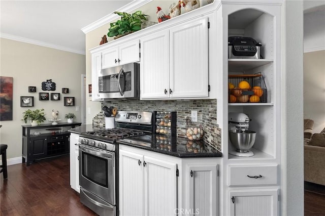 226 Stony Creek Dr, Orland, CA 95963 - kitchen featuring appliances with stainless steel finishes, ornamental molding, dark wood finished floors, and tasteful backsplash