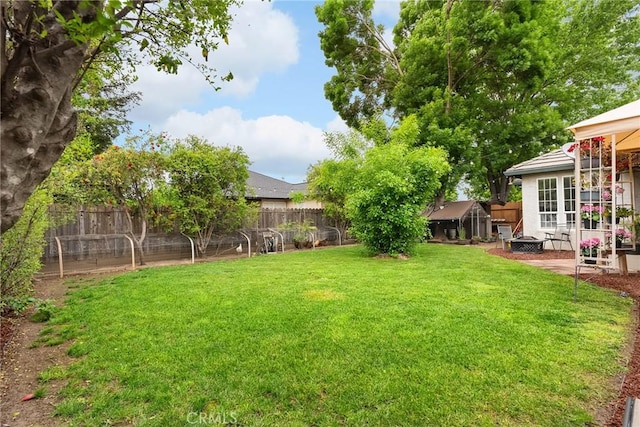 226 Stony Creek Dr, Orland, CA 95963 - view of yard featuring a patio, a fenced backyard, and a fire pit