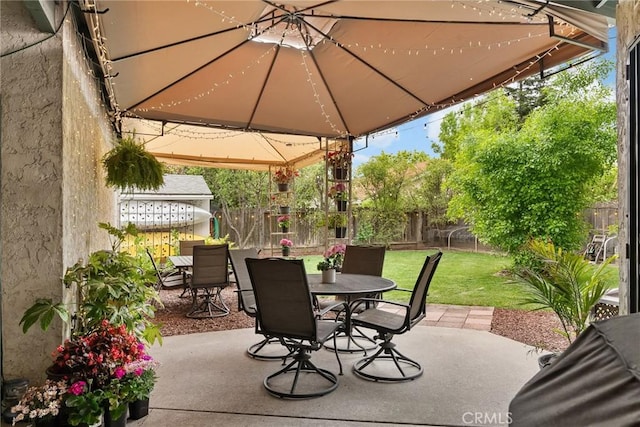 226 Stony Creek Dr, Orland, CA 95963 - view of patio with a gazebo, a fenced backyard, and outdoor dining space