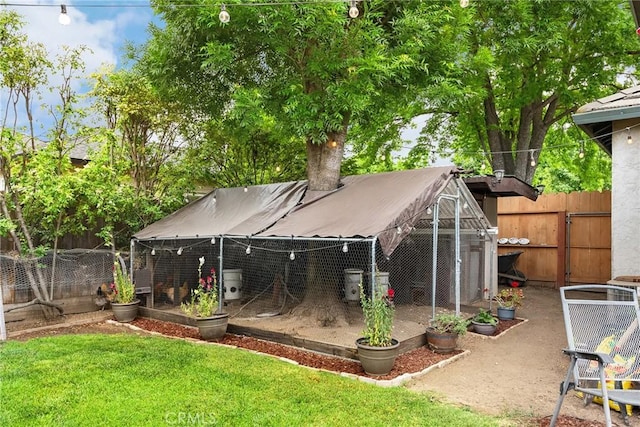 226 Stony Creek Dr, Orland, CA 95963 - back of property with fence, an outdoor structure, and a yard
