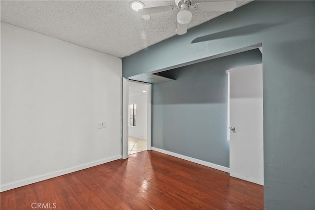 15430 Parthenia St, North Hills, CA 91343 - empty room featuring wood finished floors, a textured ceiling, a ceiling fan, and baseboards