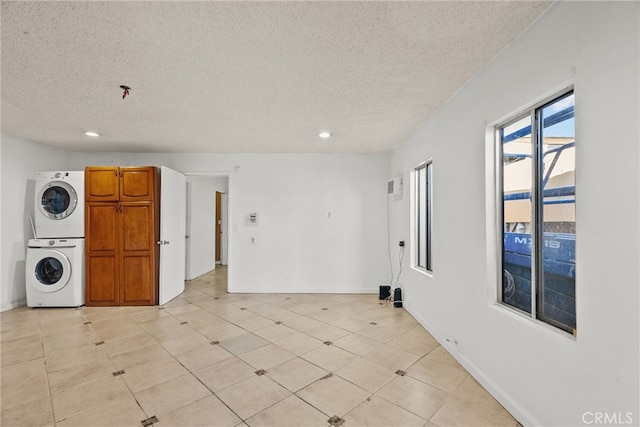 15430 Parthenia St, North Hills, CA 91343 - empty room with recessed lighting, baseboards, stacked washing maching and dryer, and a textured ceiling