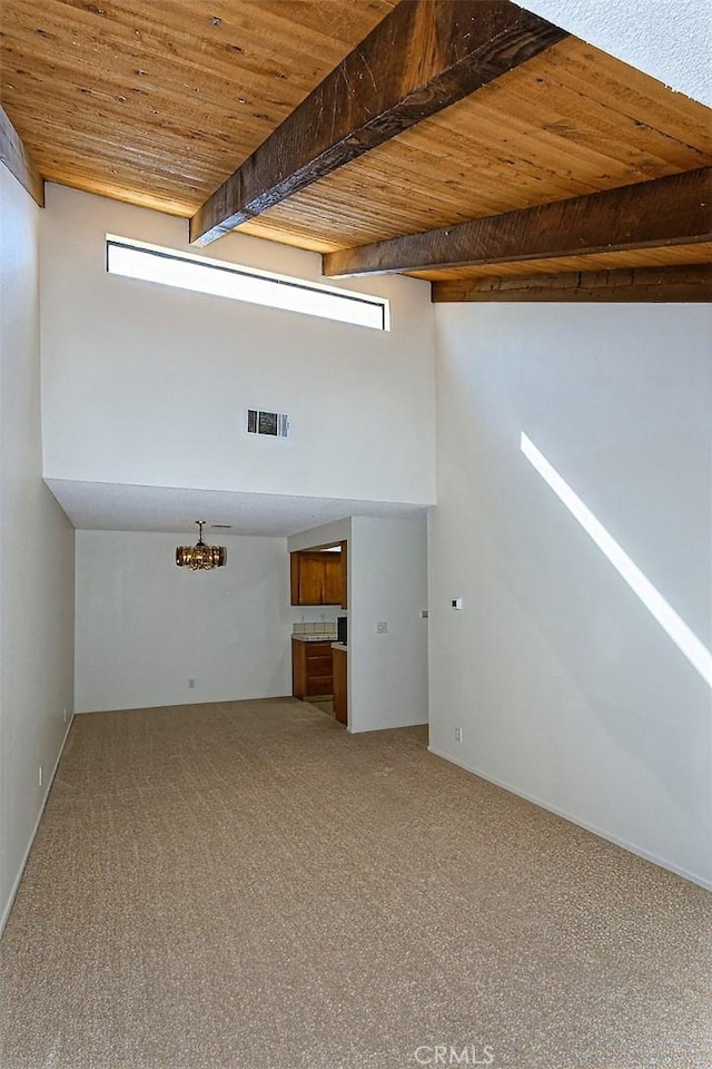 interior space with carpet, visible vents, and wooden ceiling