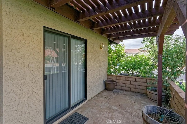 view of patio featuring a pergola