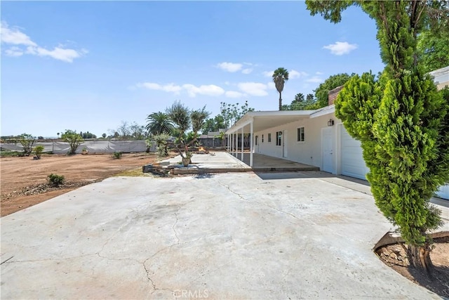 exterior space with an attached carport