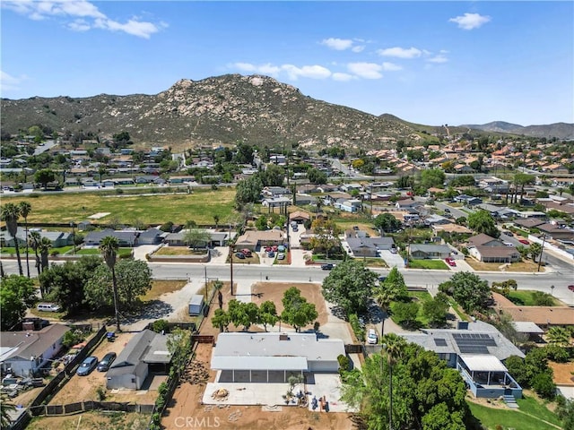 drone / aerial view featuring a residential view and a mountain view