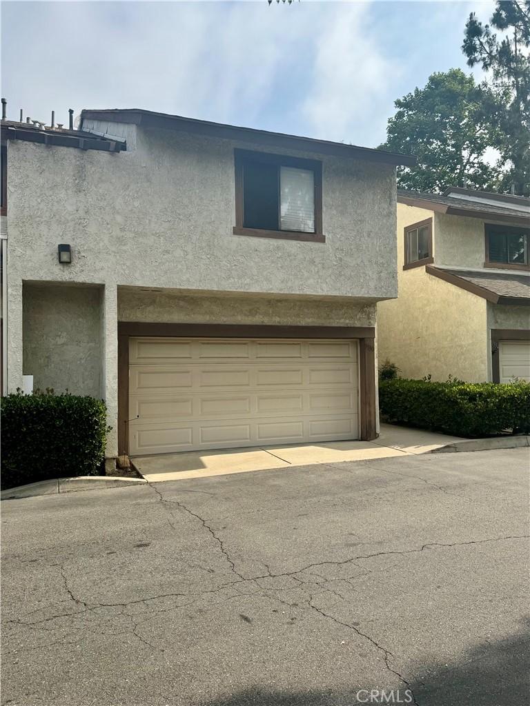9330 Silverleaf Way, Rancho Cucamonga, CA 91701 - view of front of home featuring a garage, stucco siding, and driveway