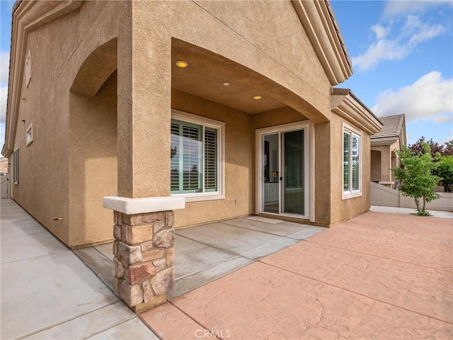 view of patio featuring fence