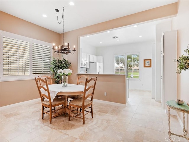 dining area featuring baseboards, recessed lighting, a chandelier, and light tile patterned floors