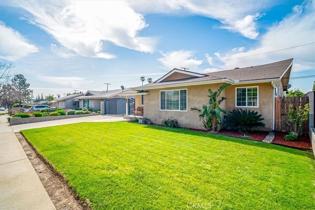 single story home featuring a front lawn, driveway, fence, a garage, and stucco siding