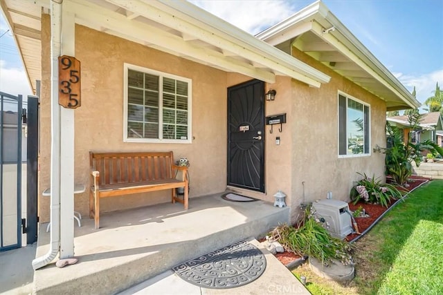 doorway to property with stucco siding