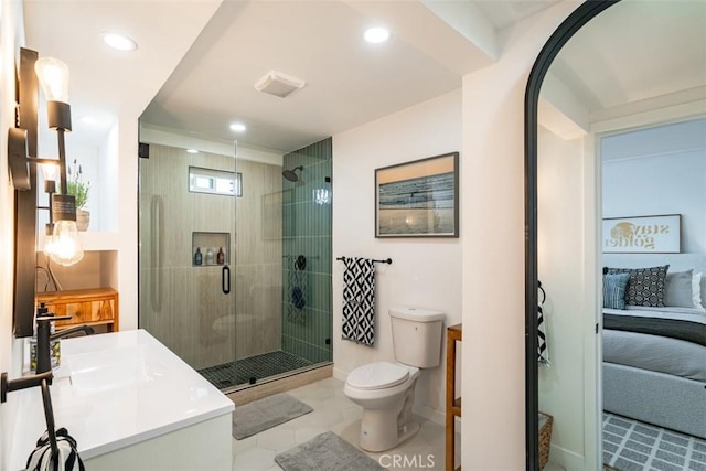 ensuite bathroom with recessed lighting, a shower stall, toilet, vanity, and ensuite bath