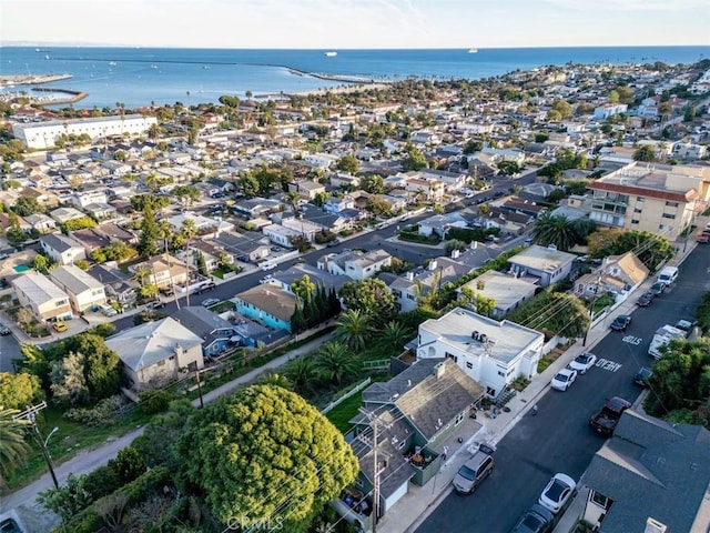 birds eye view of property with a residential view and a water view