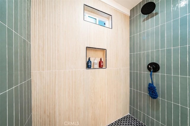full bathroom with a tile shower