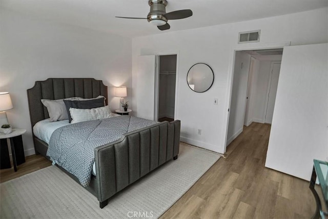 310 N Jackson St Unit 330, Glendale, CA 91206 - bedroom featuring wood finished floors, a closet, a walk in closet, baseboards, and visible vents