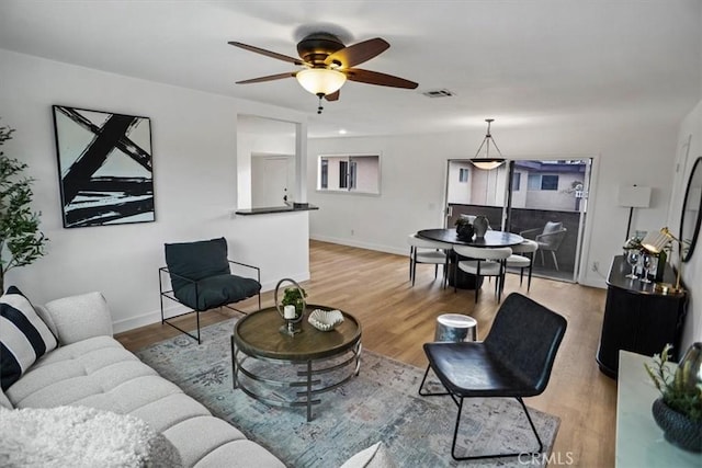 310 N Jackson St Unit 330, Glendale, CA 91206 - living room with baseboards, light wood-style flooring, visible vents, and ceiling fan