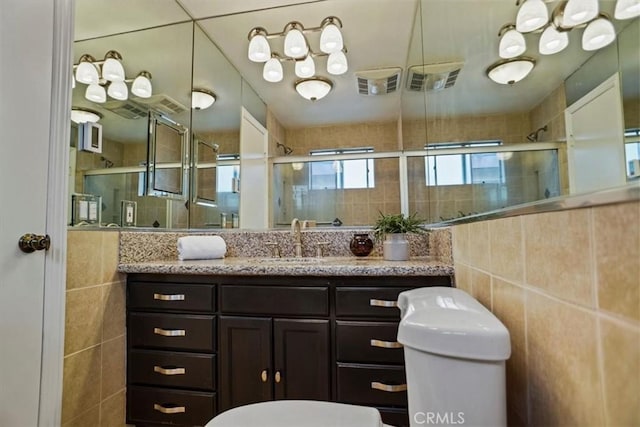 310 N Jackson St Unit 330, Glendale, CA 91206 - bathroom with tile walls, visible vents, toilet, and a stall shower