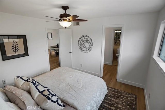 310 N Jackson St Unit 330, Glendale, CA 91206 - bedroom with baseboards, a ceiling fan, wood finished floors, and visible vents