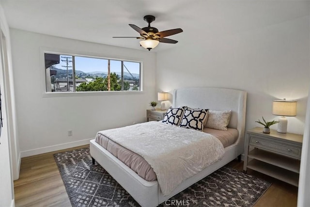 310 N Jackson St Unit 330, Glendale, CA 91206 - bedroom with wood finished floors, baseboards, and ceiling fan