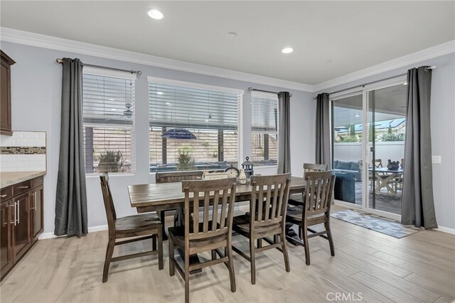 25889 Basil Ct, Corona, CA 92883 - dining space with crown molding, light wood finished floors, baseboards, and recessed lighting