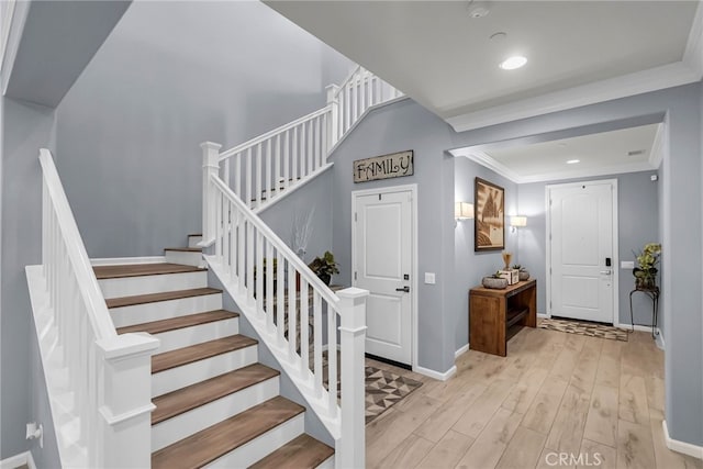 25889 Basil Ct, Corona, CA 92883 - stairway featuring wood finished floors, baseboards, recessed lighting, and crown molding