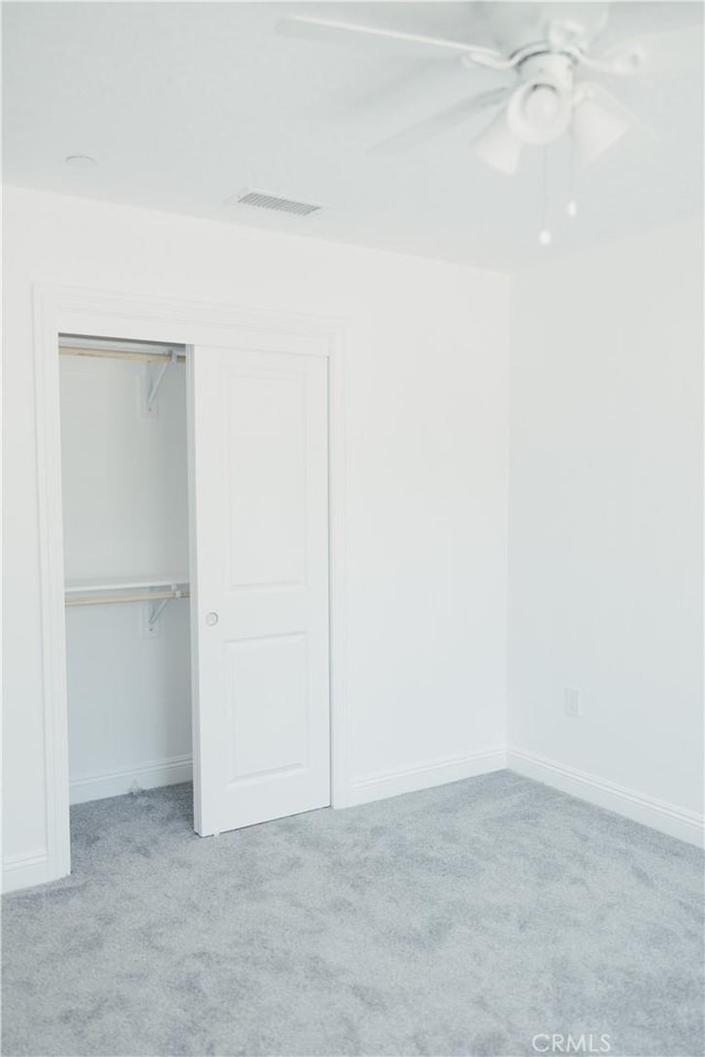 7452 Chase Ave, Hesperia, CA 92345 - unfurnished bedroom featuring carpet flooring, a closet, a ceiling fan, and baseboards