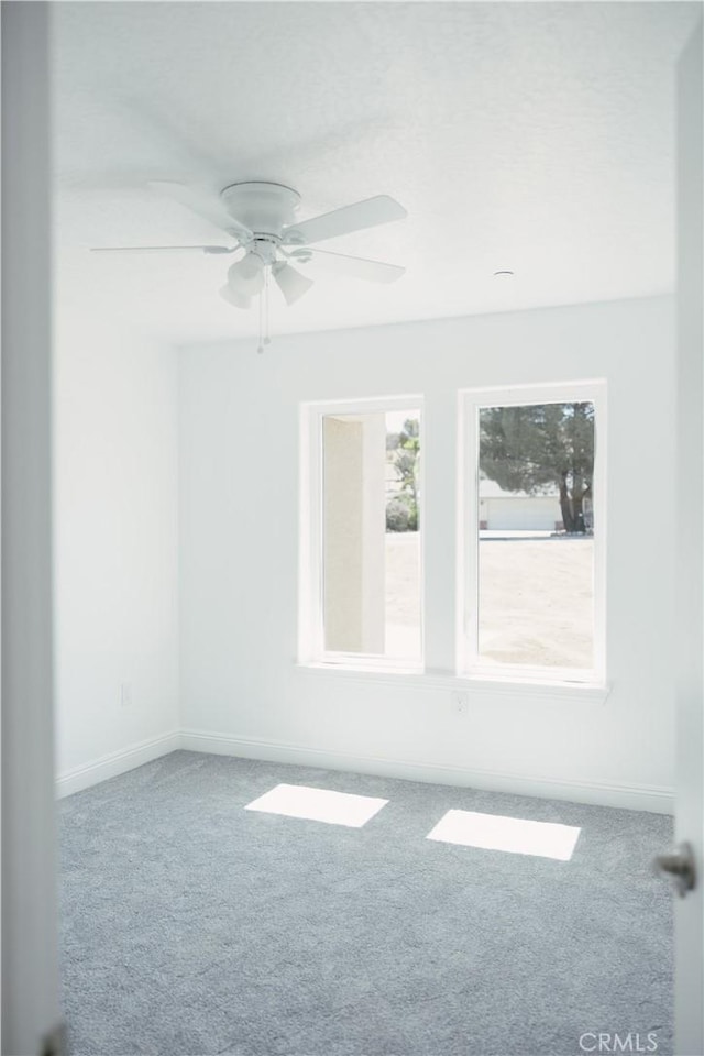 7452 Chase Ave, Hesperia, CA 92345 - carpeted spare room with baseboards and a ceiling fan