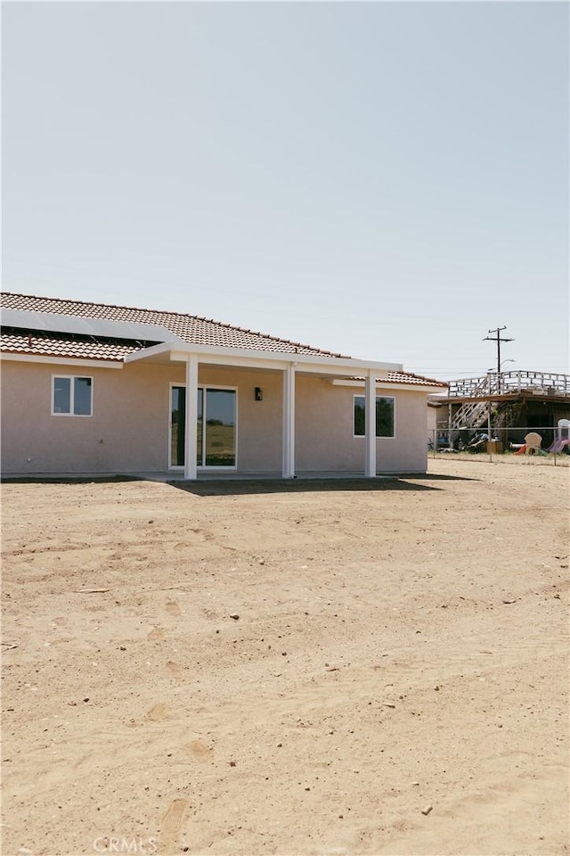 7452 Chase Ave, Hesperia, CA 92345 - back of property with stucco siding and a tile roof