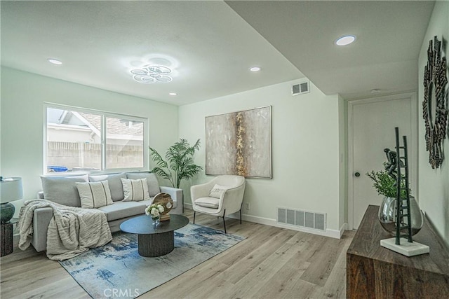 sitting room featuring recessed lighting, visible vents, light wood finished floors, and baseboards