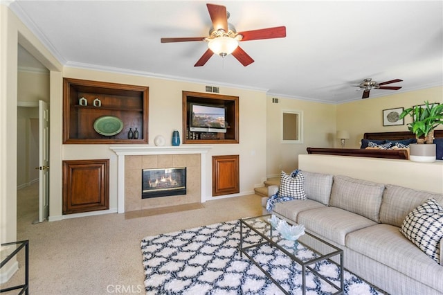 20904 Parkside, Lake Forest, CA 92630 - carpeted living room featuring a ceiling fan, crown molding, a tile fireplace, and baseboards