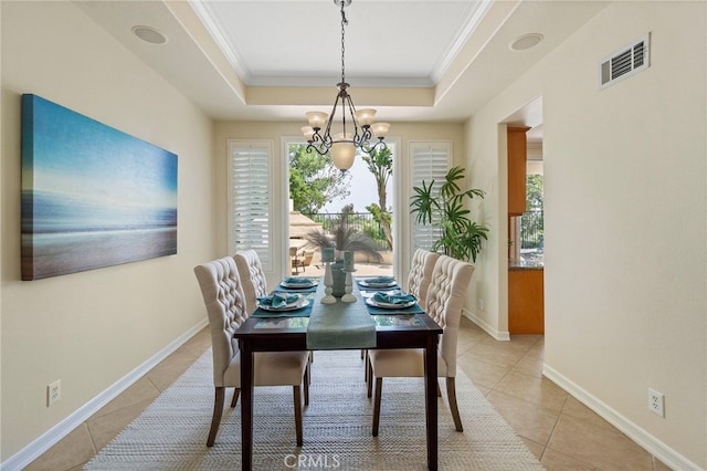20904 Parkside, Lake Forest, CA 92630 - dining space featuring light tile patterned flooring, a tray ceiling, a chandelier, crown molding, and baseboards