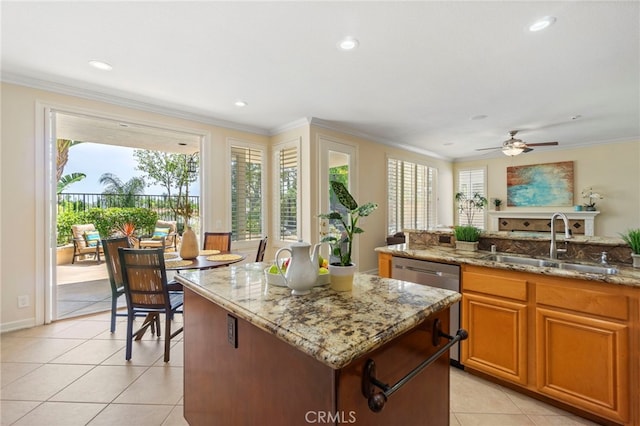 20904 Parkside, Lake Forest, CA 92630 - kitchen featuring a sink, a center island, healthy amount of natural light, ornamental molding, and light tile patterned flooring