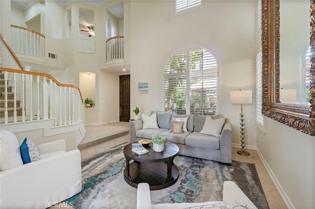 20904 Parkside, Lake Forest, CA 92630 - living room with tile patterned flooring, stairs, a high ceiling, and baseboards
