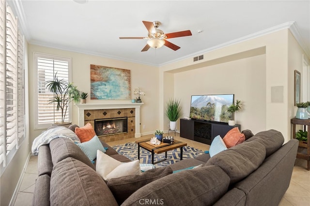 20904 Parkside, Lake Forest, CA 92630 - living room with ceiling fan, ornamental molding, light tile patterned floors, a tiled fireplace, and baseboards