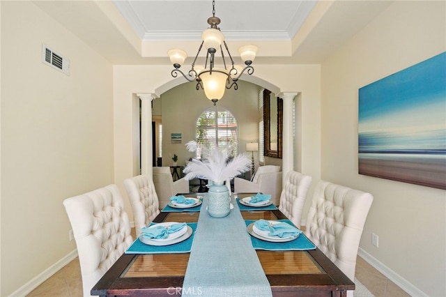 20904 Parkside, Lake Forest, CA 92630 - dining space featuring decorative columns, arched walkways, a raised ceiling, light tile patterned floors, and crown molding