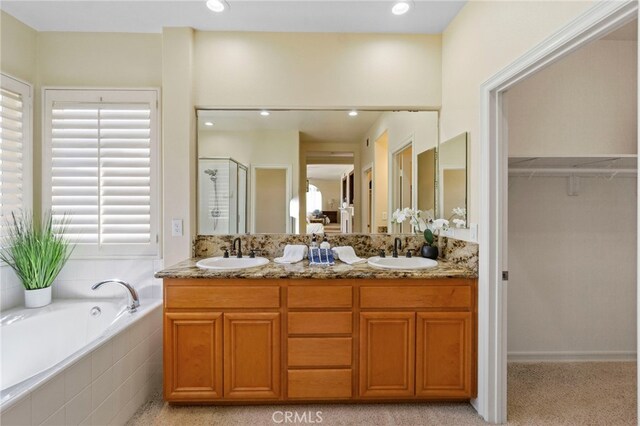 20904 Parkside, Lake Forest, CA 92630 - full bath with a stall shower, a garden tub, double vanity, a walk in closet, and recessed lighting