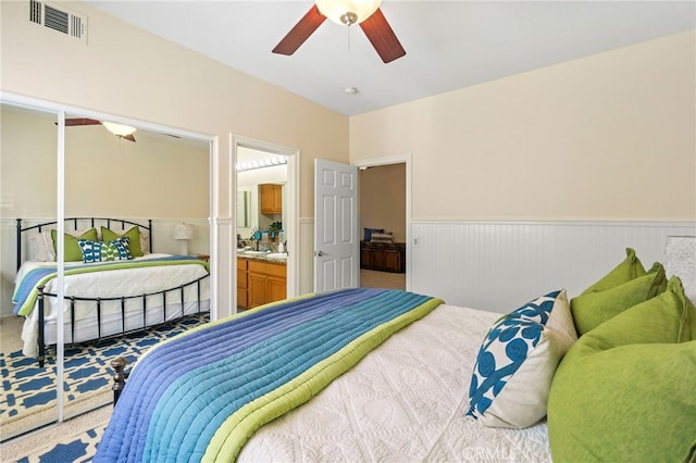 20904 Parkside, Lake Forest, CA 92630 - carpeted bedroom featuring wainscoting, ceiling fan, and connected bathroom