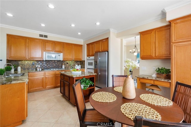 20904 Parkside, Lake Forest, CA 92630 - kitchen with a sink, stainless steel appliances, crown molding, tasteful backsplash, and light stone counters