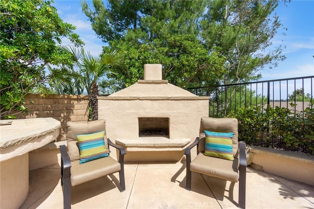 20904 Parkside, Lake Forest, CA 92630 - view of patio / terrace with an outdoor fireplace and fence