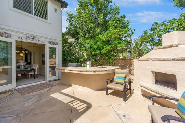20904 Parkside, Lake Forest, CA 92630 - view of patio / terrace with an outdoor fireplace