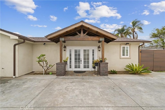 9614 Cypress Ave, Fontana, CA 92335 - back of house with french doors, stucco siding, a patio, and fence