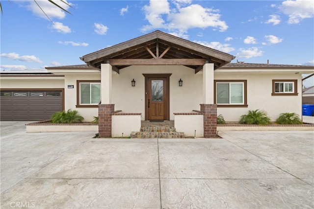 9614 Cypress Ave, Fontana, CA 92335 - view of front of home with stucco siding and roof mounted solar panels
